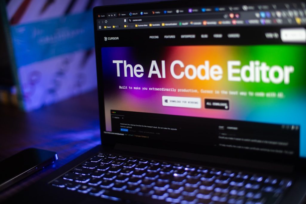 Laptop displays the AI code editor website