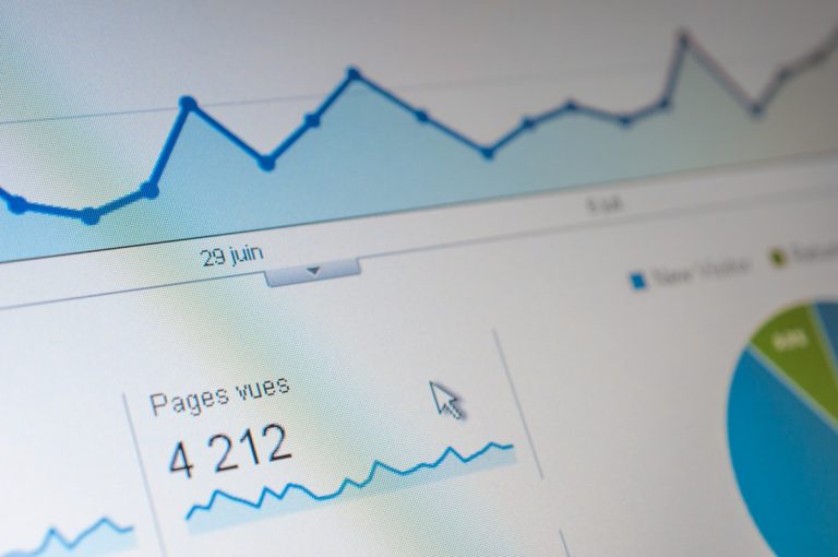 A close-up view of a computer screen displaying analytics and performance graphs