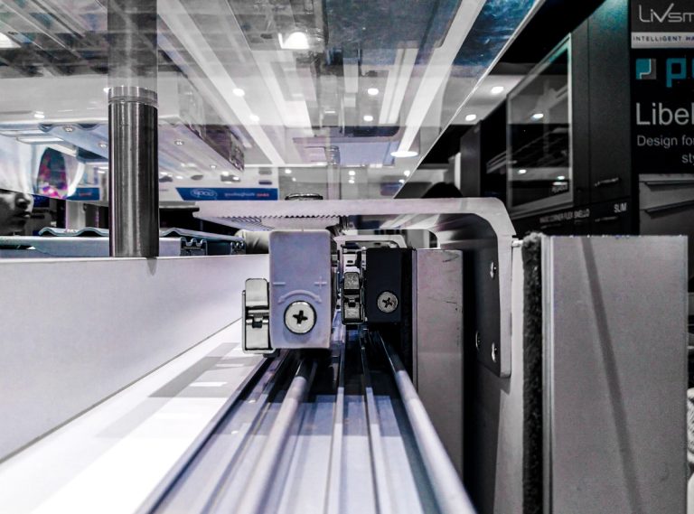 a long metal conveyor belt inside of a building