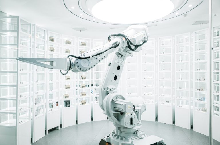 white robotic arm in display showroom