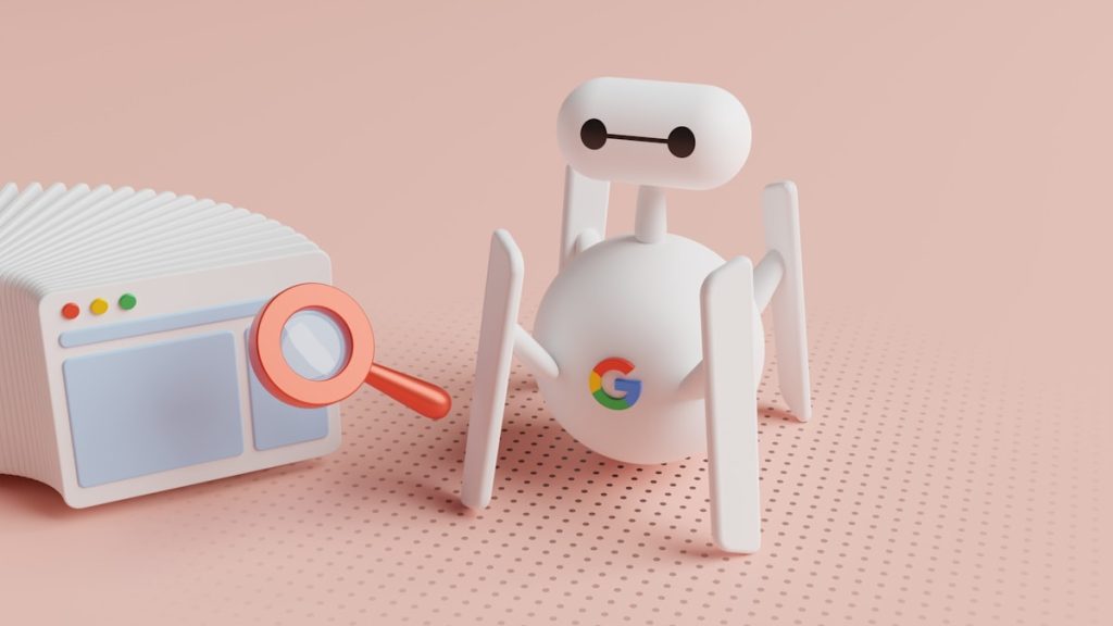 a small white robot next to a small white radio