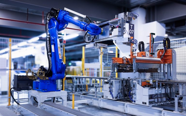 blue industrial robot arm in factory