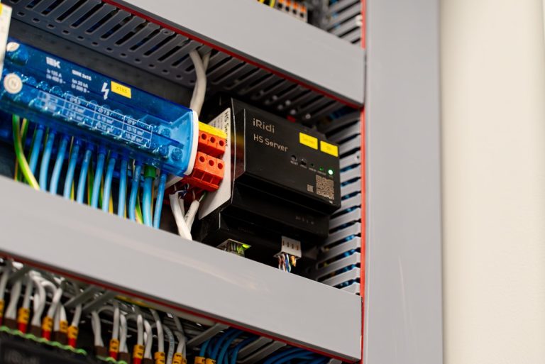 Electrical panel with wires and components.