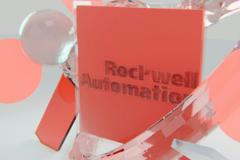 Rockwell automation logo on a red block with abstract shapes