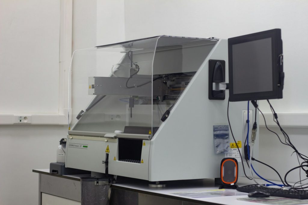 a large white machine with a monitor