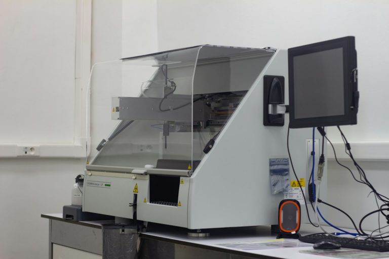 a large white machine with a monitor